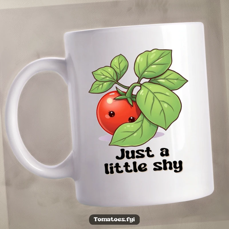 Funny shy tomato character with a bashful expression peeking from behind a large green basil leaf on a ceramic mug.