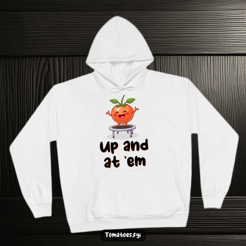 Funny Hoodie: Happy tomato character comically bounces on a trampoline, a cozy and humorous garment.
