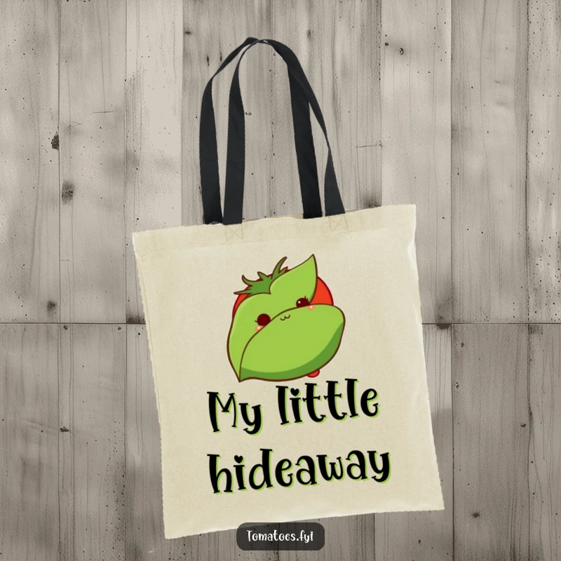 Funny tote bag displays a shy tomato peeking from behind a leaf, a cute and practical accessory for carrying daily items.